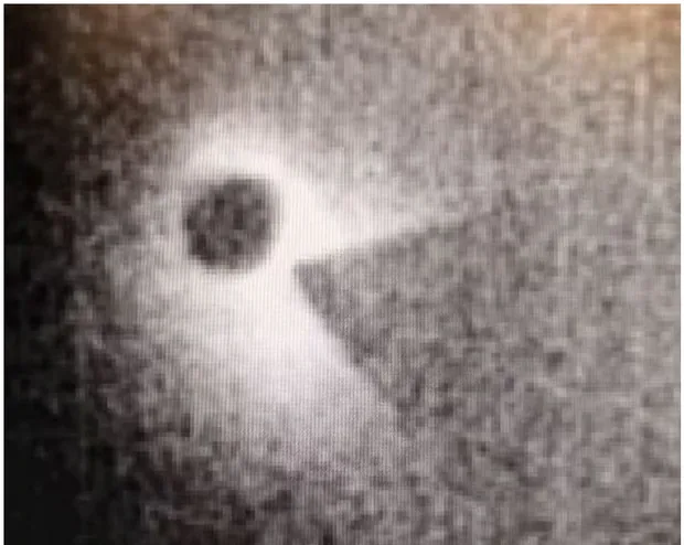 A terahertz photograph — a 3 mm hole and a metal blade, imaged straight onto a terahertz camera. Single short exposure, nothing corrected.